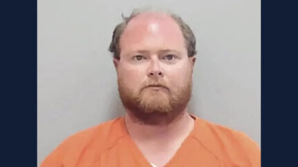 Jonathan Dibble appears in a mugshot for child porn charges in Florida.